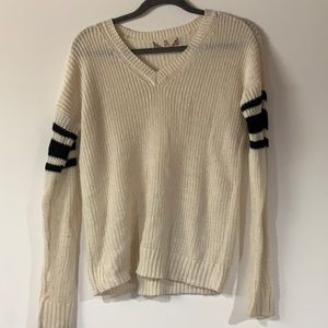 White sweater with black details on sleeves